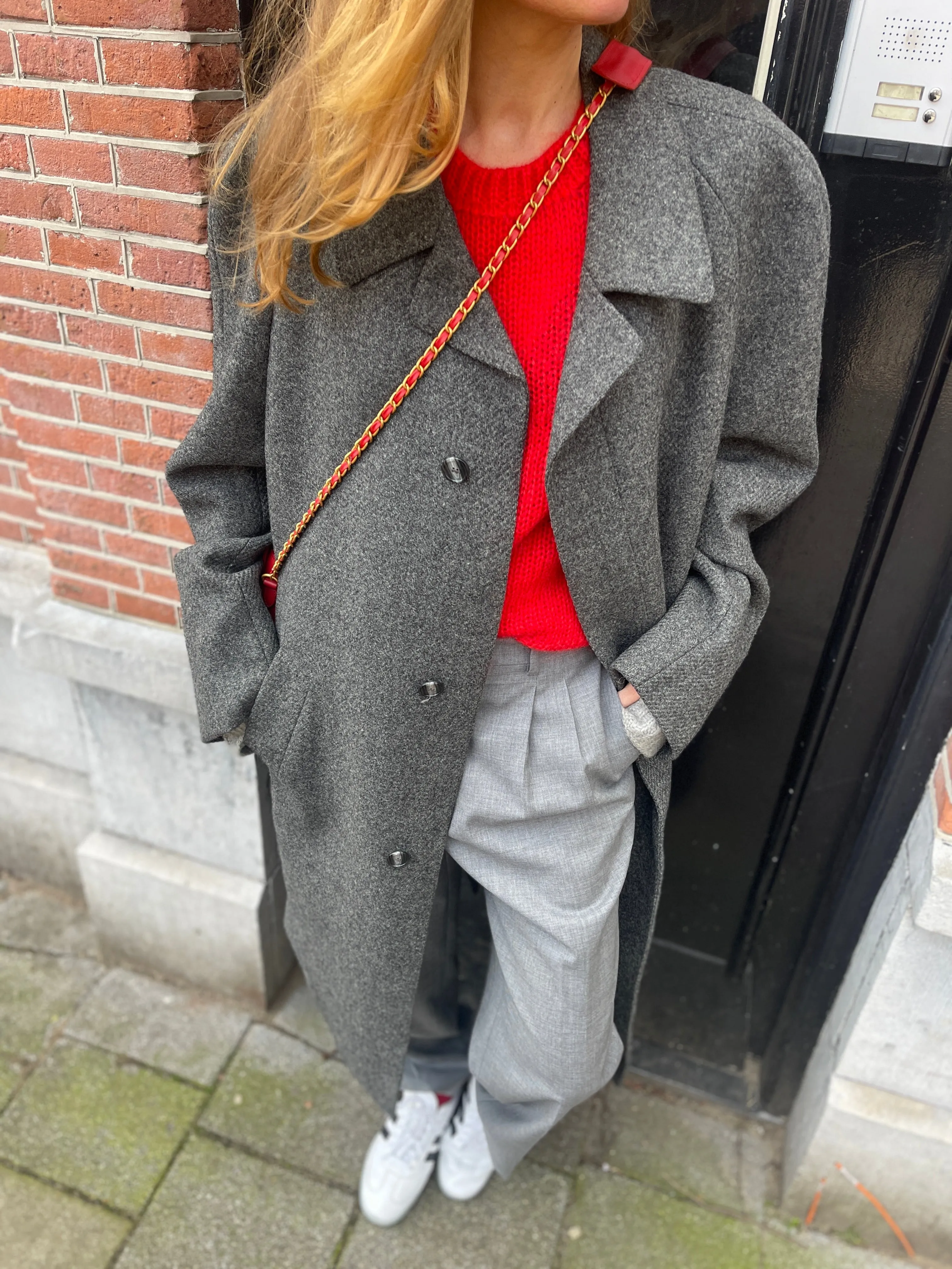 Light grey pleated pants.